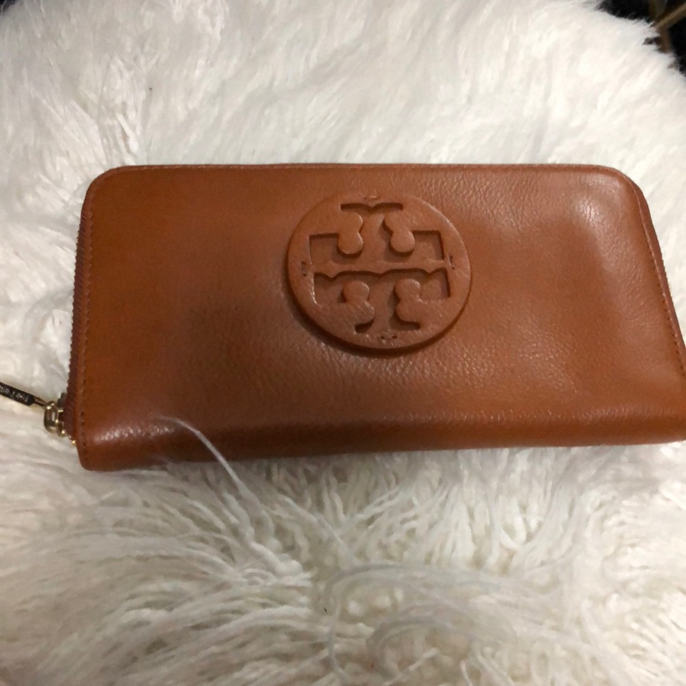 Tan Tory Burch wallet with gold zipper